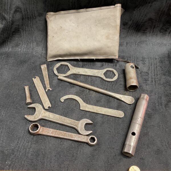 Vintage Triumph BSA motorcycle tool kit with spanners and tool.