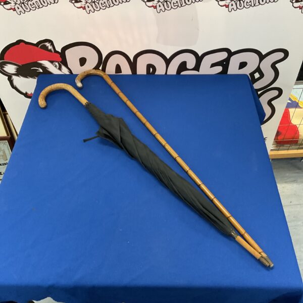 Vintage walking canes featuring bamboo and a silver knop.
