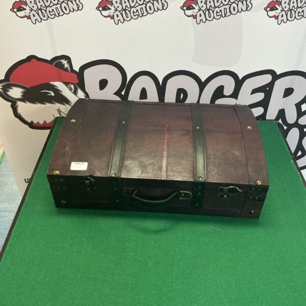 Front view of a vintage wooden bottle carrying case.