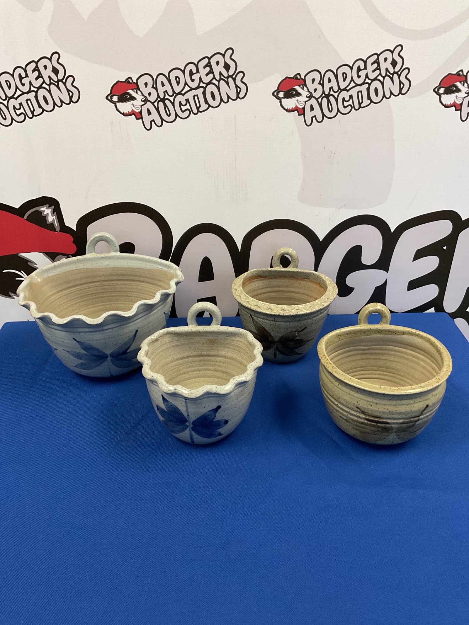 083 Four welsh pottery wall pocket plant pots