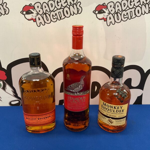 Sealed whiskey bottles including Monkey Shoulder, Bulleit Bourbon, and The Famous Grouse.