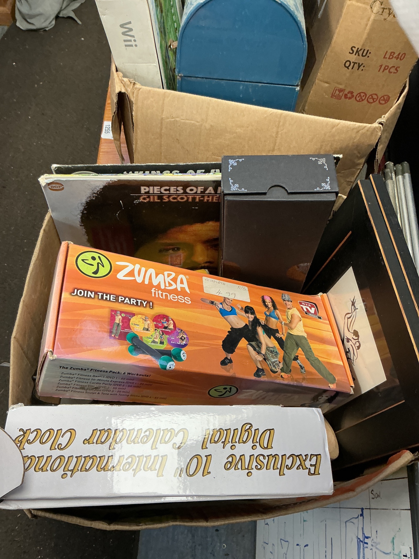 1256 Box of mixed items inc Zumba Fitness party